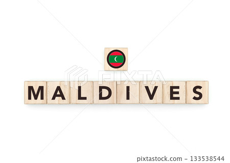 Wooden blocks bearing the name and flag of Maldivas. Maldivian and North Indian Culture, national identity, travel, and geography in a copy space design. Wooden blocks bearing the name and flag of Maldivas. Maldivian and North Indian Culture, national identity, travel, and geography in a copy space design. 133538544