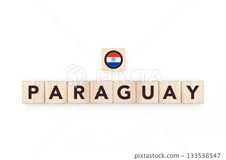 Wooden blocks bearing the name and flag of Paraguay. Paraguayan and South American Culture, national identity, travel, and geography in a copy space design. 133538547