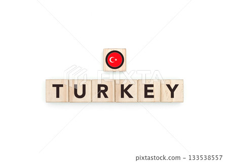 Wooden blocks bearing the name and flag of Turkey. Turkish and European and Asian Culture, national identity, travel, and geography in a copy space design. 133538557
