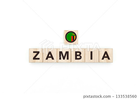 Wooden blocks bearing the name and flag of Zambia. Zambian and South African Culture, national identity, travel, and geography in a copy space design. 133538560