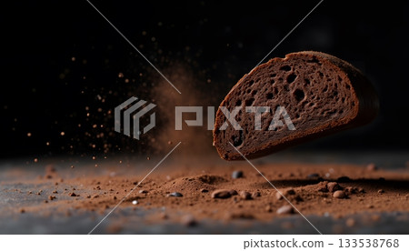 Sliced Chocolate Bread with Cocoa Powder and Dark Background for Culinary Concept 133538768