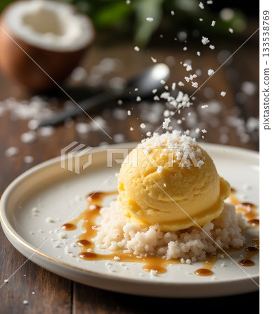 Creamy Mango Ice Cream on Rice with Coconut Shavings and Caramel Drizzle 133538769