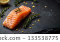 Fresh Salmon Fillet with Herbs and Spices on Dark Surface Ready for Cooking 133538775
