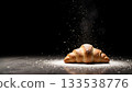 Freshly Baked Croissant with Sugar Dust on Dark Background in Studio Setting 133538776