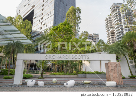 Orchard Scotts entrance with modern architecture and lush greenery Orchard Scotts entrance with modern architecture and lush greenery 133538932
