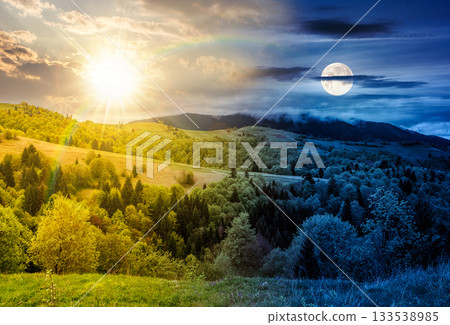 forest in mountain rural area. day and night time change concept. landscape with green agricultural field on a hillside with sun and moon at twilight. spring duality and transition template forest in mountain rural area. day and night time change concept. landscape with green agricultural field on a hillside with sun and moon at twilight. spring duality and transition template 133538985