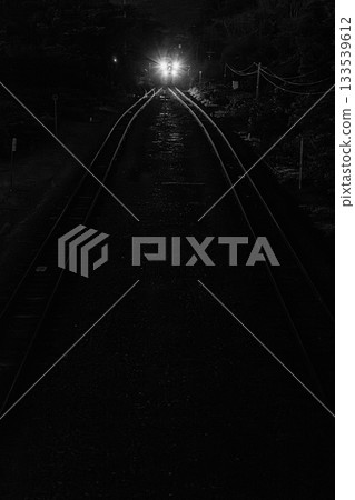 Train lights running in the dark night — Night view of the Hakodate Main Line 133539612