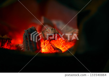 Red hot charcoal stove 133540864