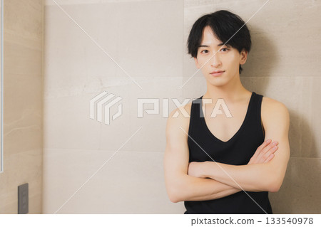 A young man looking at a mirror 133540978