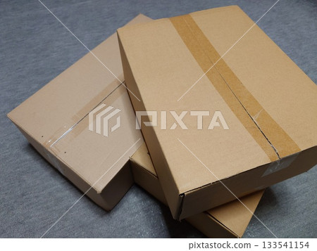 Packed and stacked cardboard boxes "Moving image" 133541154