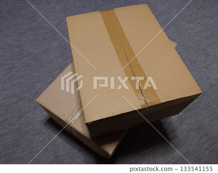 Packed and stacked cardboard boxes "Moving image" 133541155