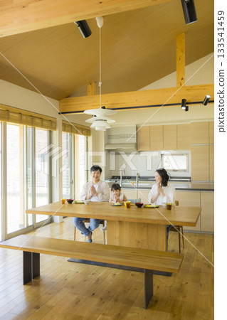 A happy family at the dinner table 133541459