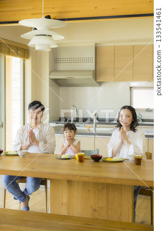 A happy family at the dinner table 133541461