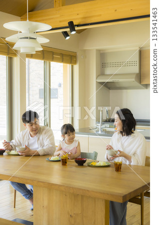 A happy family at the dinner table 133541463