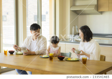 A happy family at the dinner table 133541465