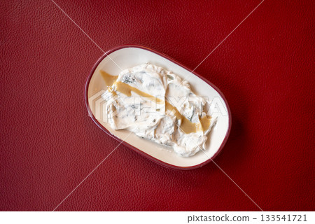 Yogurt Meze with Olive Oil on Red Background Yogurt Meze with Olive Oil on Red Background 133541721