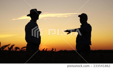 Sunset teamwork handshake wheat field agriculture farm, Farmers finalizing deal dusk, wheat Business agreement amid golden crops, Collaboration agriculture under evening sky, Successful harvest Sunset teamwork handshake wheat field agriculture farm, Farmers finalizing deal dusk, wheat Business agreement amid golden crops, Collaboration agriculture under evening sky, Successful harvest 133541862