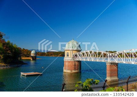 Lake Tama's water intake tower, autumn leaves, and Belluna Dome Lake Tama's water intake tower, autumn leaves, and Belluna Dome 133542420