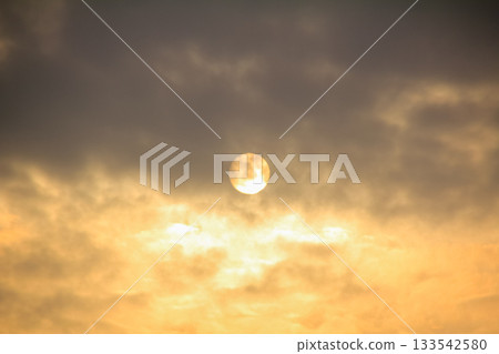Full moon with dramatic cloudscape. Cloudy overcast sky with moon. Nature scene. 133542580