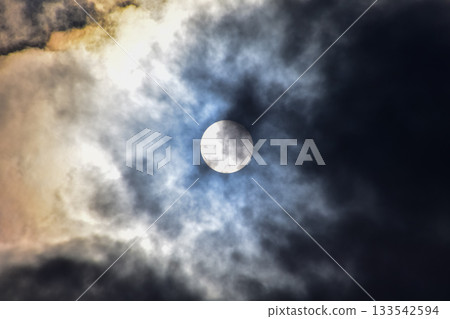 Full moon with dramatic cloudscape. Cloudy overcast sky with moon. Nature scene. Full moon with dramatic cloudscape. Cloudy overcast sky with moon. Nature scene. 133542594