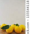 Yuzu fruit on the table 133544118