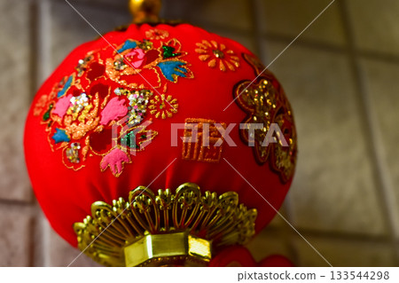 Traditional Chinese new year decorations. Lucky money bag with the Chinese character 'fu'. The Spring Festival China traditional ornaments. For blessing. Translation: Luck. Traditional Chinese new year decorations. Lucky money bag with the Chinese character 'fu'. The Spring Festival China traditional ornaments. For blessing. Translation: Luck. 133544298