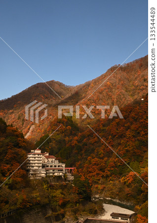 A hot spring inn surrounded by colorful mountains A hot spring inn surrounded by colorful mountains 133544489