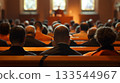 Back of a congregation during a church service, capturing the solemn atmosphere of shared faith and worship. 133544967