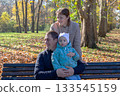 Lovely family in an autumn park. 133545159