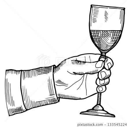 A hand holding a wine glass 133545224