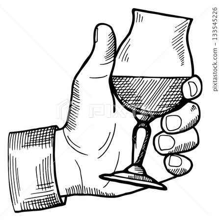 A hand holding a wine glass A hand holding a wine glass 133545226