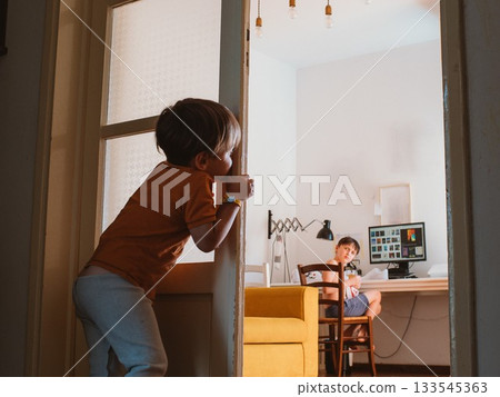 Two Brothers Interacting at Home in Casual Setting 133545363