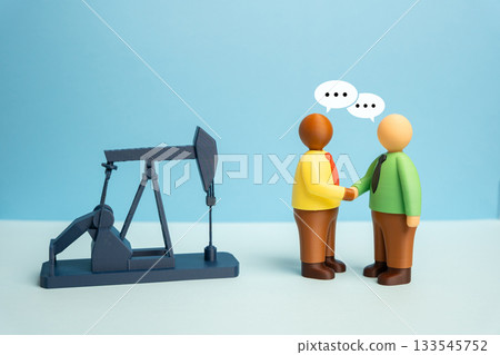 Businessmen negotiate oil production and energy resource sales. Purchase and sale of mineral deposits. Services technological assistance in mineral resource development. Geopolitical energy relations 133545752