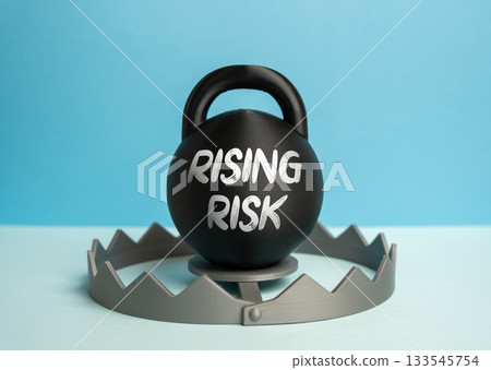 A weight in a trap threatening to close the trap. Growing risks in business and the economy. Financial risk, market instability and economic warnings. Investment strategy, crisis management A weight in a trap threatening to close the trap. Growing risks in business and the economy. Financial risk, market instability and economic warnings. Investment strategy, crisis management 133545754