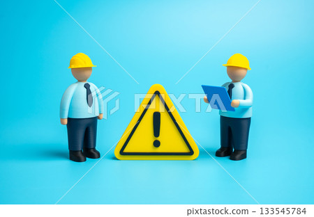 Construction engineers are dealing with a technical problem. Finding a technological solution. Elimination of breakdowns and malfunctions. New construction issues. Permits and regulations. 133545784