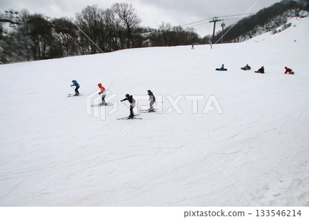 Kids enjoying skiing Kids enjoying skiing 133546214