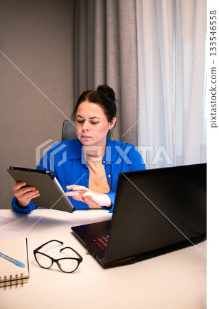 Student attending virtual university class via video conference. Young woman actively participates in online lecture, taking notes on laptop. Distance learning and educational technology concepts Student attending virtual university class via video conference. Young woman actively participates in online lecture, taking notes on laptop. Distance learning and educational technology concepts 133546558