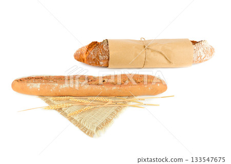 Two Fresh Baguettes Isolated on White: Rustic Wrapped and Traditional Loaf 133547675