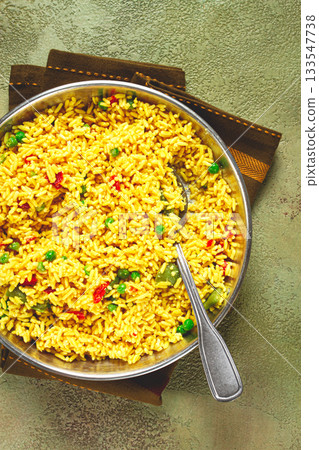 rice with saffron and vegetables, in a frying pan, top view, homemade, no people, rice with saffron and vegetables, in a frying pan, top view, homemade, no people, 133547738