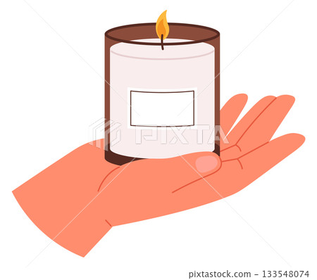 A hand holding a candle in a glass container A hand holding a candle in a glass container 133548074