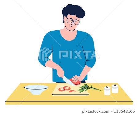 A man is cutting vegetables on a table A man is cutting vegetables on a table 133548100