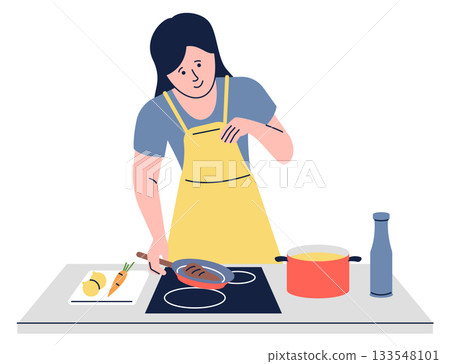 A woman is cooking in a kitchen with a yellow apron on A woman is cooking in a kitchen with a yellow apron on 133548101