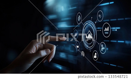 A hand approaches a glowing digital interface filled with various icons and symbols, showcasing technology and interaction A hand approaches a glowing digital interface filled with various icons and symbols, showcasing technology and interaction 133548721