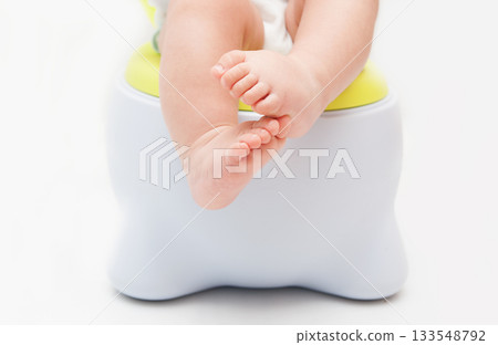 Children's legs hanging down from a chamber-pot Children's legs hanging down from a chamber-pot 133548792