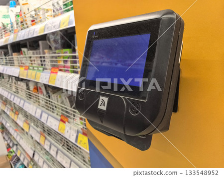 Price checker gadget in retail store for convenient product information Price checker gadget in retail store for convenient product information 133548952