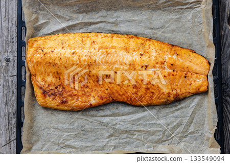 roasted whole salmon fillet on baking sheet roasted whole salmon fillet on baking sheet 133549094