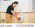 Mom is cleaning the bathroom 133549896