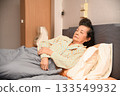 An old woman is sleeping on the bed 133549932