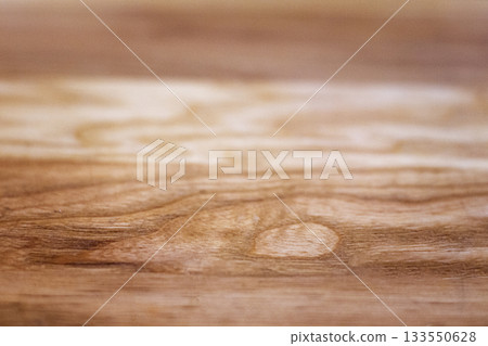 Close up of warm wood surface with natural grain and knot patterns, rustic texture 133550628
