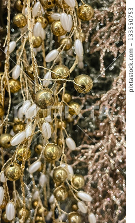 Abstract texture of elegant gold metallic beads and white pearl clusters for a festive background Abstract texture of elegant gold metallic beads and white pearl clusters for a festive background 133550753